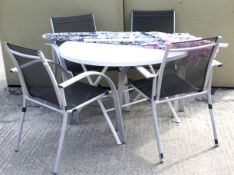 A set of four garden chairs, a circular table and a parasol.