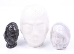 A group of three ceramic busts. Two inscribed 'J. B.'. Max.