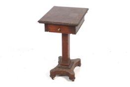 A Victorian mahogany side table with quatrefoil base.