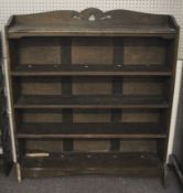 An Edwardian oak free standing book case. With three adjustable shelves.