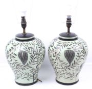 A pair of contemporary ceramic lamp bases. Painted green with fern details.
