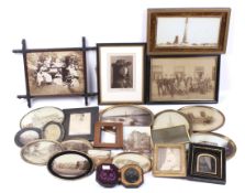An assortment of Victorian and later photographs, mostly framed.