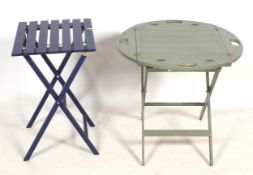 Two contemporary folding side tables.