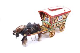 A porcelain horse and gypsy caravan.