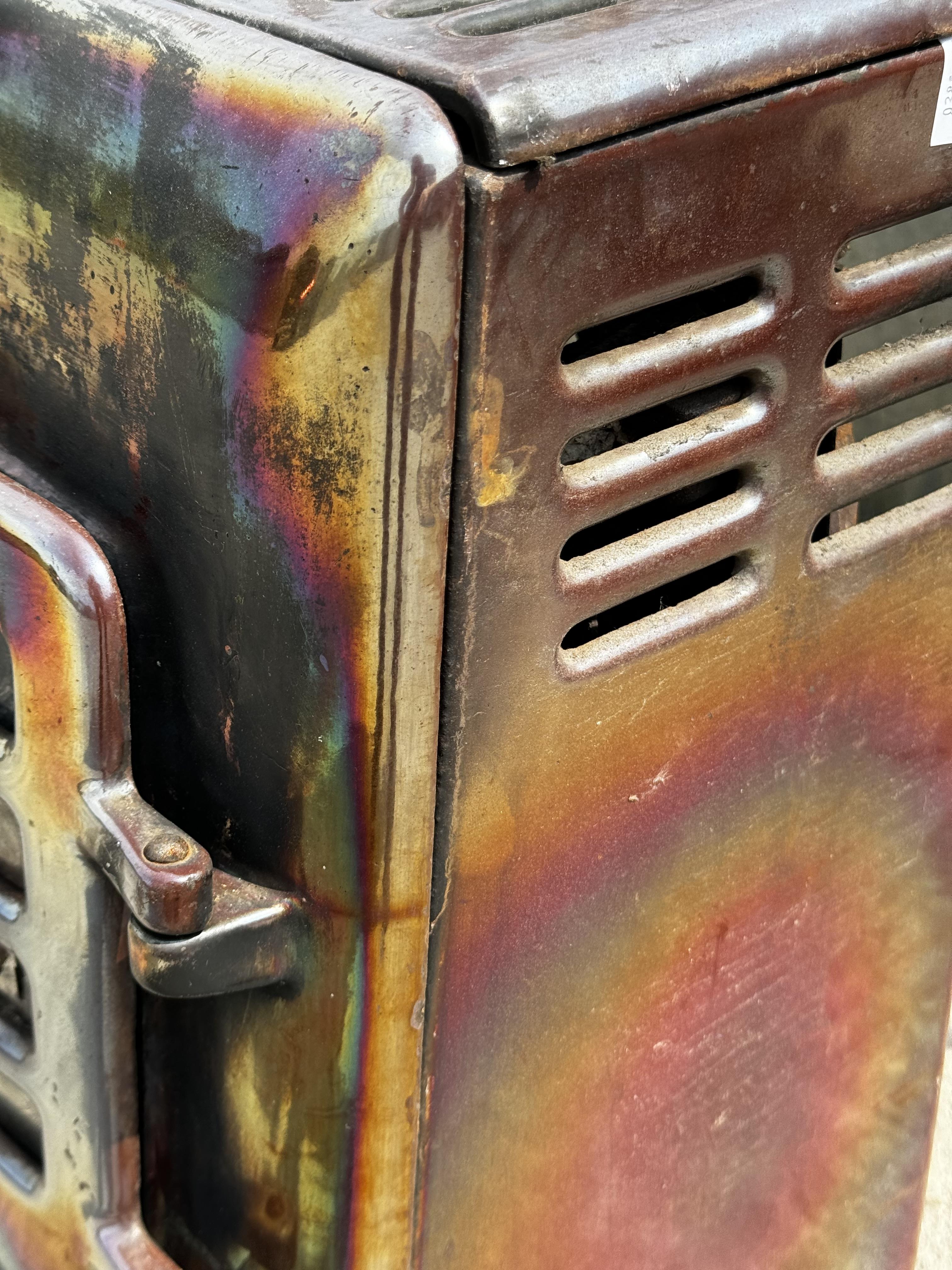 A metal woodburning stove. With hinged front doors and spare metal plates, H60cm x W44cm x D30cm. - Image 3 of 4