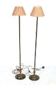 A pair of standard lamps.