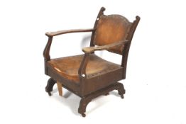 An antique oak rocking chair.