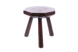 A vintage oak tripod table/stool.