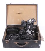A vintage Pathescope cine film projector and reels of film.