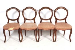 Set of four balloon carved back mahogany framed chairs.