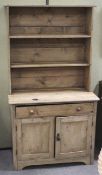 A small pine kitchen dresser.