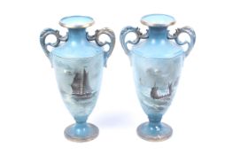 A pair of Victorian Thomas Forester & Sons Phoenix ware blue twin handle vases.