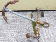 A cast iron ships anchor formerly painted in light blue. Approx.