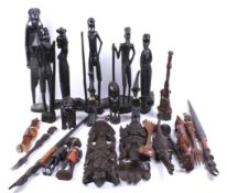 A large assortment African carved wooden sculptures.
