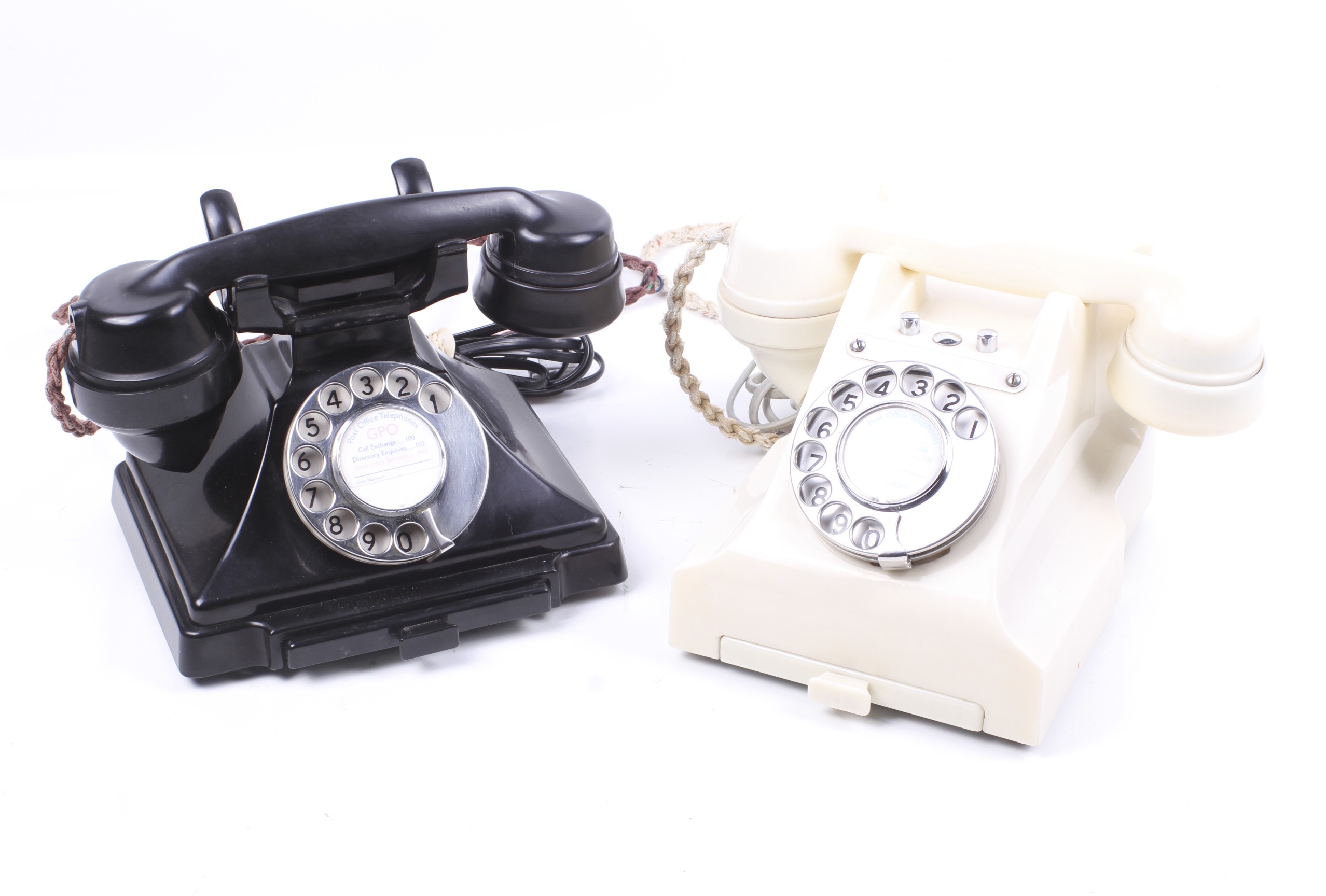 Two vintage bakelite rotary telephones. Including a black pyramid GPO telephone with no.