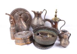 A collection of assorted Islamic copper and brass metalware items.