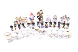 A collection of assorted china figures, items and gollies.