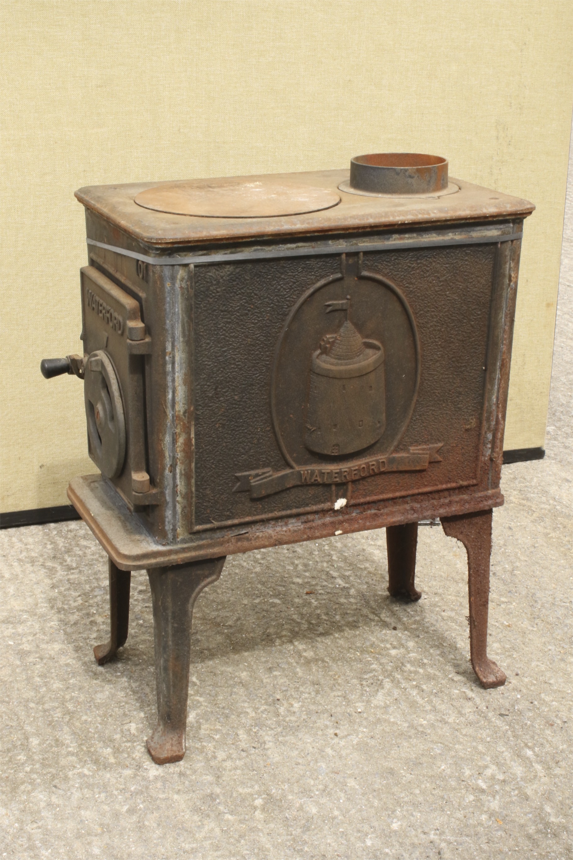 A Waterford wood burner. Having a decorative panel to the front.