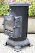 A gas powered conservatory fire. Having a faux fire grate to the front. H75cm.