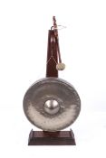 A 20th century brass dinner gong on stand.