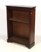 A Georgian style mahogany free standing bookcase. With two adjustable shelves.