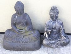Two black painted ornamental garden Buddhas. Max.