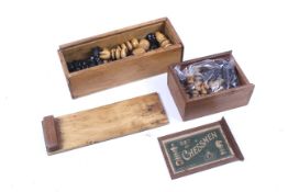 Two vintage chess sets. Including a wooden example by J. J.