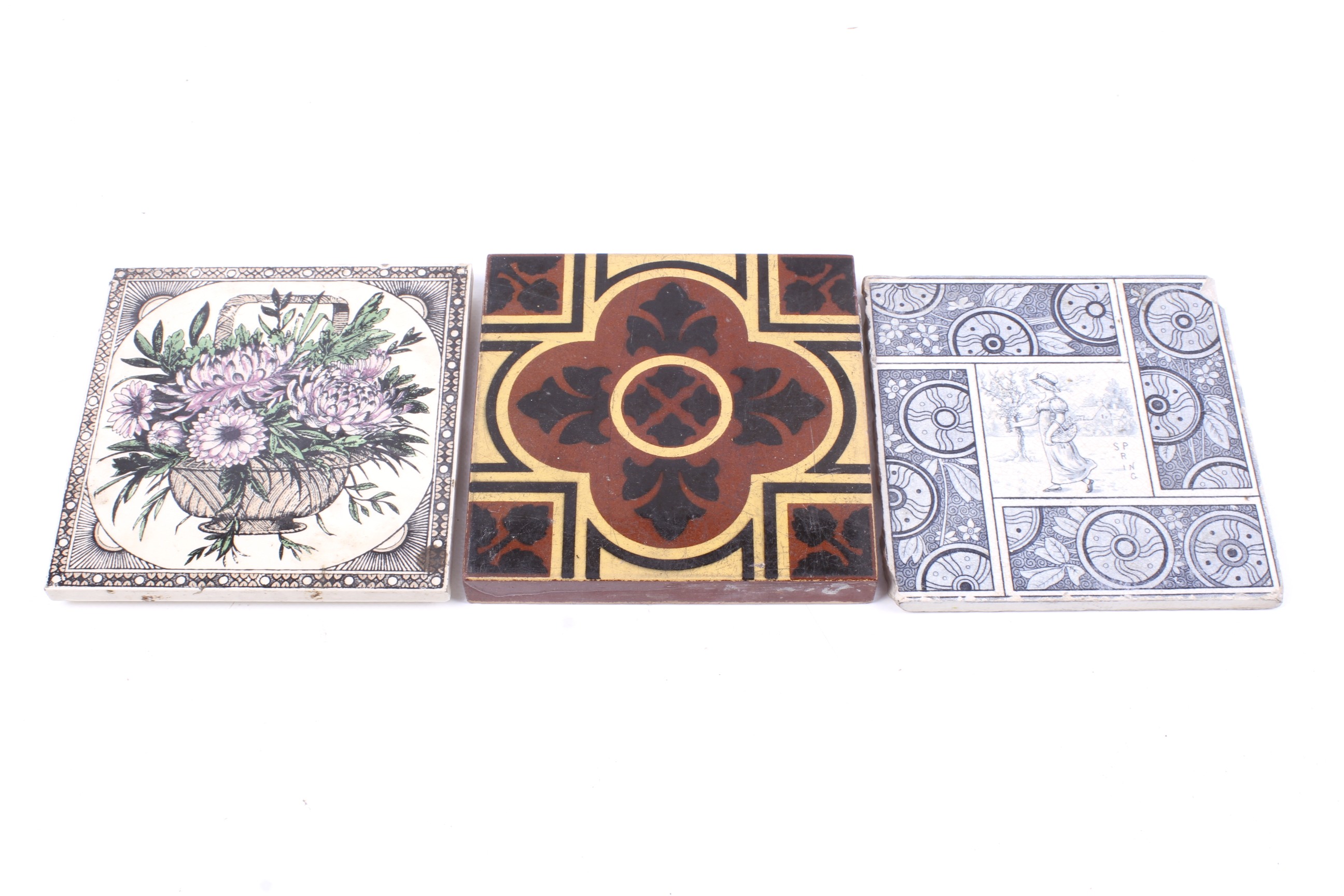 A group of three decorative Victorian ceramic items. Consisting of two tiles and a trivit.