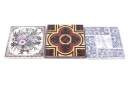 A group of three decorative Victorian ceramic items. Consisting of two tiles and a trivit.
