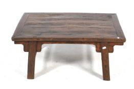 A Chinese 'antique style' plank top hardwood coffee table.