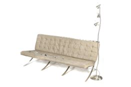 After Mies Van De Rohe - 'Barcelona Pavillion' three-seater sofa and a floor light.