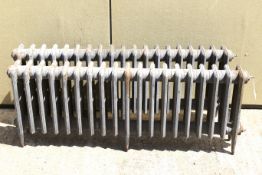 A pair of vintage metal radiators. H46cm x W121cm x D14.