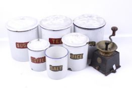 A collection of six assorted vintage enamel storage jars.