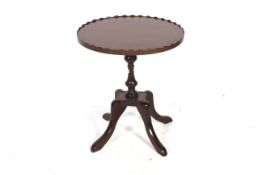 A mahogany occasional table.