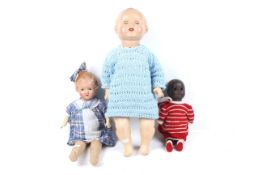 Three vintage dolls.