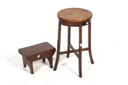 A vintage wooden stool and circular table.