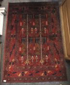 A Persian style red ground wool rug.