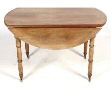 A mahogany drop leaf table. Raised on turned supports, on casters, H72.5cm x W119.