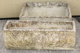 Two reconstituted stone planters.