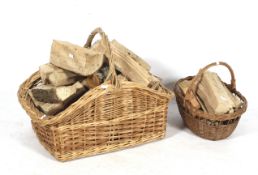 Two wicker baskets with fire wood logs. Both with handles to the top, Max.