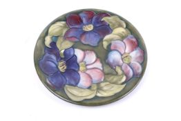 A Moorcroft clematis pattern plate.
