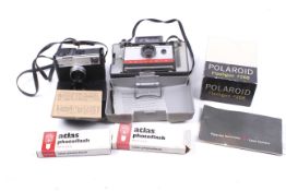 A vintage Polaroid Land Camera Automatic 104, accessories, etc.
