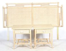 A bamboo framed headboard and a pair of bedside cabinets.