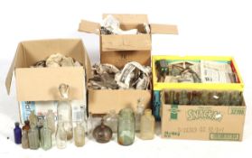 A large collection of glass bottles and decanters.