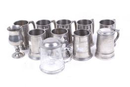 A collection of pewter tankards. Including an example by A. E.
