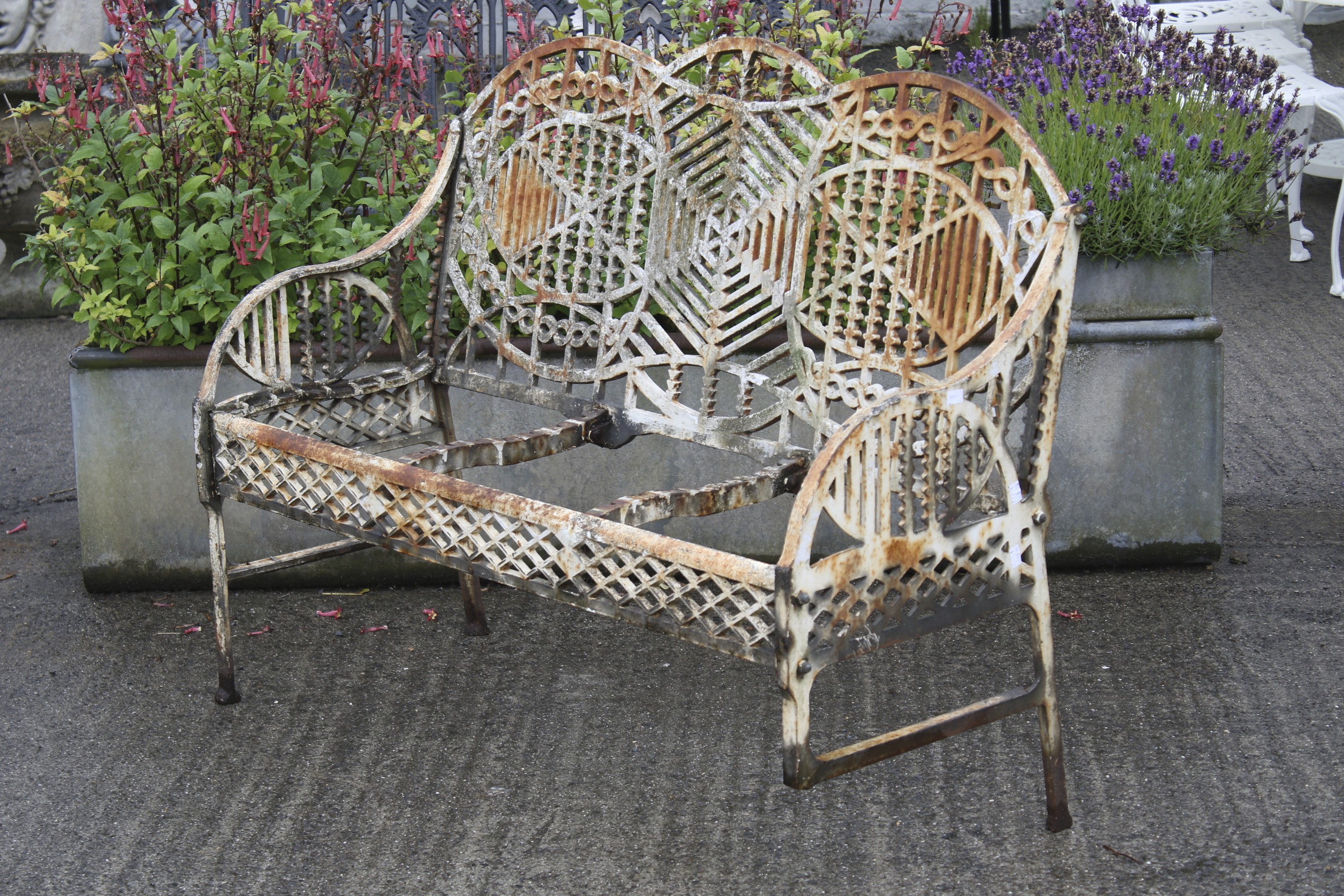 A mid 20th century cast iron garden bench designed by Edward Bawden for the Bilston Foundry.