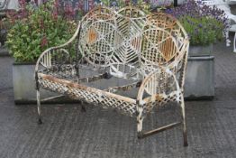 A mid 20th century cast iron garden bench designed by Edward Bawden for the Bilston Foundry.