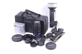 A collection of Olympus Camedia lenses.