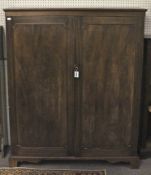 An Edwardian mahogany gentleman's tallboy wardrobe.
