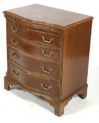 A reproduction Georgian style serpentine chest of drawers. Having four graduated drawers.